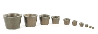 Lot AN UNUSUAL SET OF TEN 19TH CENTURY BRONZE WEIGHTS