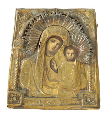 Lot AN ANTIQUE RUSSIAN ICON DEPICTING MADONNA AND CHILD