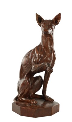 Lot A GOOD 19TH CENTURY CARVED WALNUT SCULPTURE OF A SEATED GREYHOUND