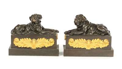 Lot AN UNUSUAL PAIR OF 19TH CENTURY BRONZE AND GILT BRONZE FIRE DOGS