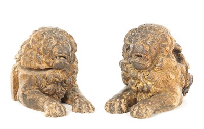 Lot A PAIR OF 17TH / 18TH CENTURY CARVED WALNUT LIONS