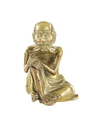 Lot AN EARLY CHINESE BRONZE FIGURE OF A SEATED LUOHUN
