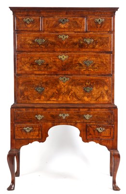 Lot 669 - A GEORGE I FIGURED WALNUT CHEST ON STAND the...