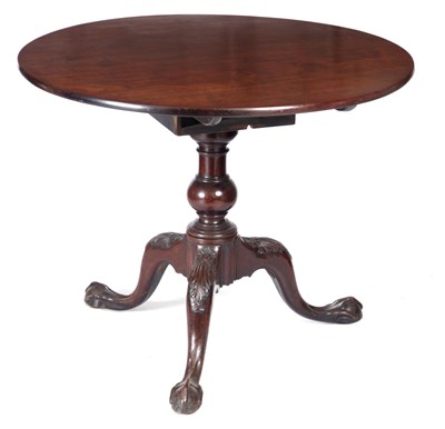 Lot 696 - A GEORGE III FIGURED MAHOGANY TILT-TOP...