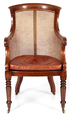 Lot 742 - A LATE REGENCY MAHOGANY BERGERE LIBRARY CHAIR...