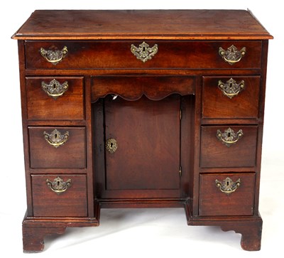 Lot 791 - A GEORGE III MAHOGANY KNEEHOLE DESK with...