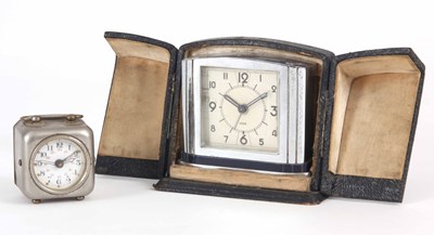 Lot 128 - TWO TRAVEL CLOCKS one art deco style in a case...