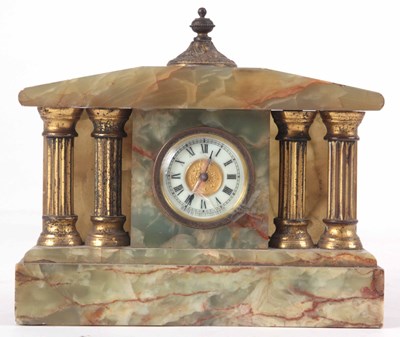 Lot 189 - AN ONYX CASED MANTLE CLOCK WITH FOUR GILT...