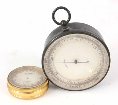 Lot 191 - A SMALL SILVERED DIAL BRASS CASED BAROMETER...