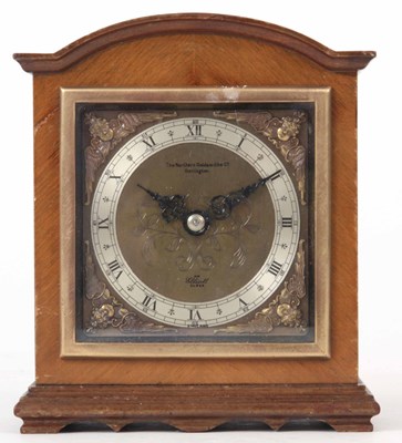 Lot 199 - A WALNUT CASED ELLIOTT MANTLE CLOCK with break...