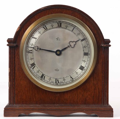 Lot 200 - A WALNUT CASED ELLIOTT MANTLE CLOCK with break...