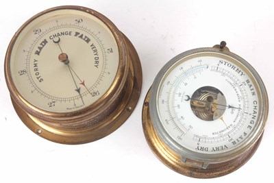 Lot 204 - TWO BRASS CASED ANEROID SHIPS BAROMETERS one...