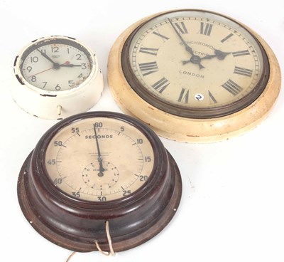 Lot 247 - THREE ELECTRIC WALL CLOCKS including a...