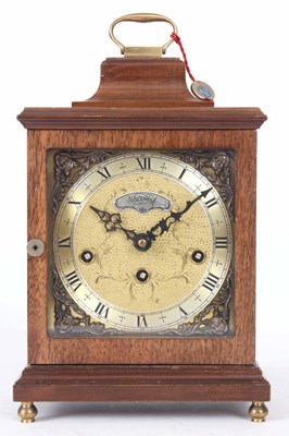 Lot 343 - A WALNUT CASED QUARTER CHIMING MANTLE CLOCK...