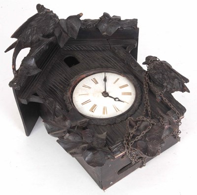 Lot 380 - A BLACK FOREST CUCKOO CLOCK carved with a...