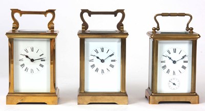 Lot 426 - THREE EIGHT DAY BRASS CASED CARRIAGE CLOCKS...