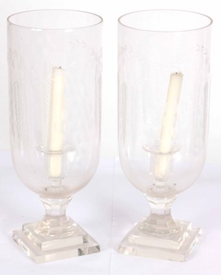 Lot 468 - A PAIR OF CUT GLASS STORM CANDLE HOLDERS 38cm...