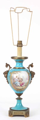 Lot 534 - A SERVES STYLE LAMP with cherub mask handles...