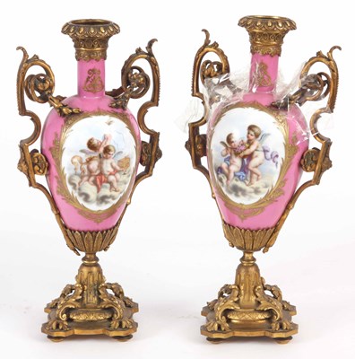 Lot 536 - A PAIR OF ORMOLU MOUNTED SERVES STYLE VASES...