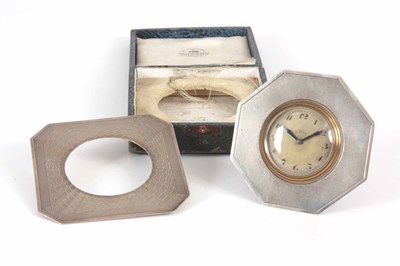 Lot 570 - A SILVER FRAMED STRUT CLOCK circa 1930 in a...