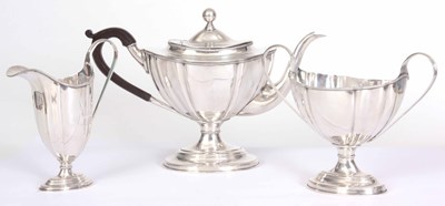 Lot 597 - A SILVER PLATED GEORGIAN STYLE THREE PIECE TEA...