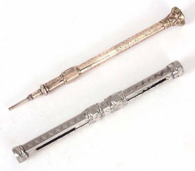 Lot 604 - A SILVER PLATED PROPELLING PENCIL AND PEN...