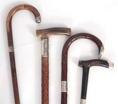 Lot 616 - FOUR WALKING STICKS one horn handle with shaft...