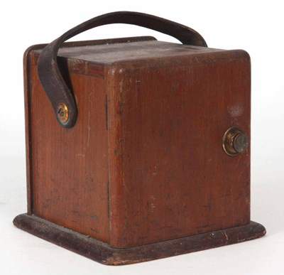 Lot 629 - A PORTABLE GENERATOR IN A WOODEN CASE 18 cm high