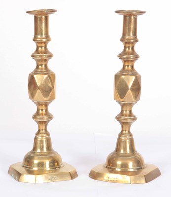 Lot 637 - A PAIR OF QUEEN OF DIAMONDS BRASS CANDLESTICKS...