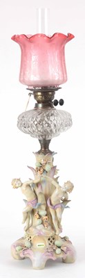 Lot 650 - A 19th CENTURY OIL LAMP WITH PORCELAIN BASE...