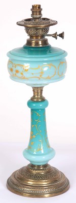 Lot 651 - A BRASS AND BLUE GLASS OIL LAMP, converted,...