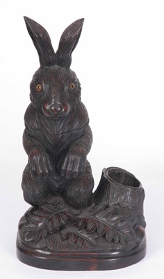 Lot 691 - A CARVED HARDWOOD BLACK FOREST TOBACCO JAR...