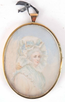 Lot 727 - A PORTRAIT MINIATURE OF A LADY oval 10.5cm...