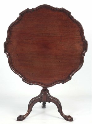 Lot 843 - A 19TH MAHOGANY TILT TOP TABLE with carved pie...