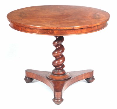 Lot 852 - A MID 19TH CENTURY FIGURED WALNUT CIRCULAR...