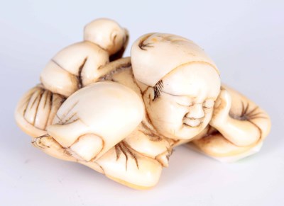 Lot 142 - A 19TH CENTURY JAPANESE CARVED IVORY NETSUKE...