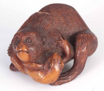 Lot 143 - A 19TH CENTURY JAPANESE CARVED NUT OKIMONO OF...