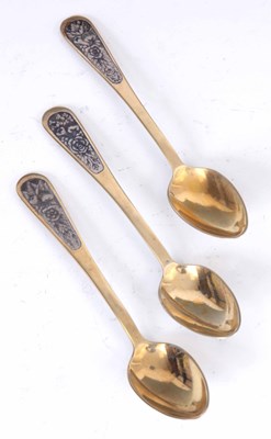 Lot 196 - A SET OF THREE RUSSIAN SILVER GILT SPOONS...