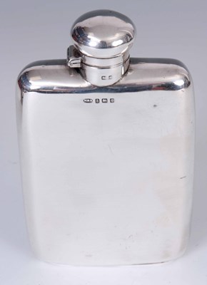 Lot 222 - A GEORGE V LARGE SILVER HIP FLASK of plain...