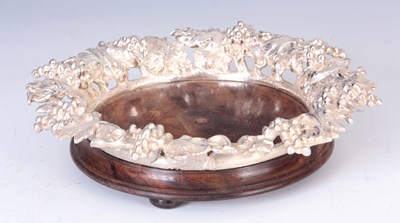 Lot 256 - AN ELABORATE CAST SILVER PLATED BOTTLE COASTER...