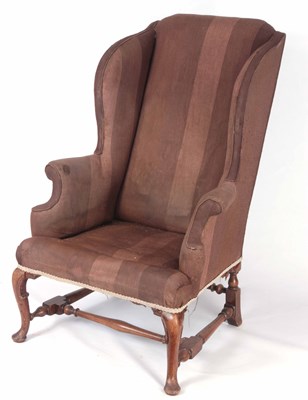 Lot 858 - A GEORGE I STYLE WALNUT WINGBACK ARMCHAIR with...