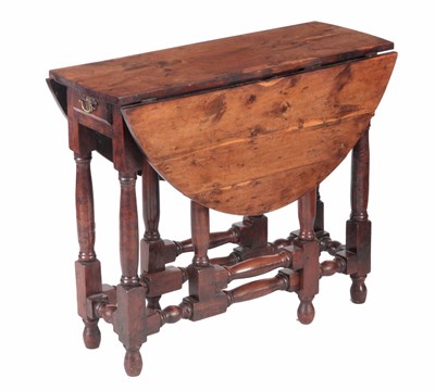 Lot 912 - A RARE 18TH CENTURY SOLID YEW GATELEG TABLE OF...