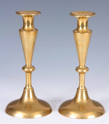 Lot 267 - AN UNUSUAL PAIR OF BRASS GEORGIAN CANDLESTICKS...