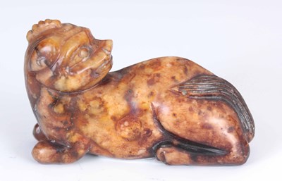 Lot 112 - A 19TH CENTURY CHINESE CARVED RUSSET JADE OF A...