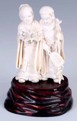 Lot 155 - A MEIJI PERIOD JAPANESE IVORY OKIMONO OF TWO...