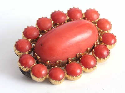 Lot 284 - A VICTORIAN 9CT GOLD AND CORAL BROOCH in a...