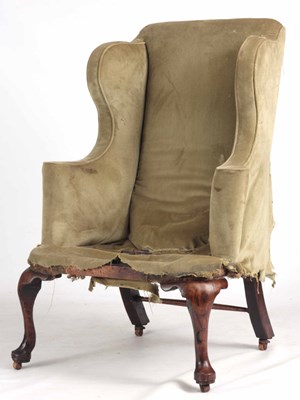 Lot 985 - A QUEEN ANNE WALNUT WING-BACK UPHOLSTERED...