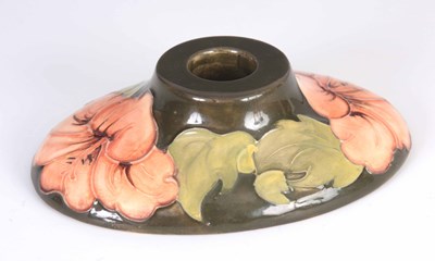 Lot 23 - A WALTER MOORCROFT HIBISCUS PATTERN CANDLE...