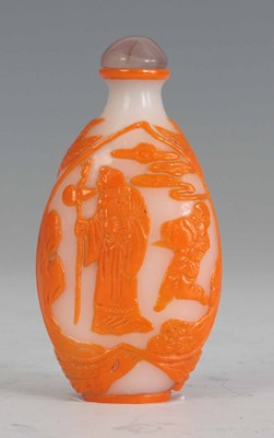Lot 89 - A CHINESE OPAQUE AND ORANGE GLASS CAMEO CUT...