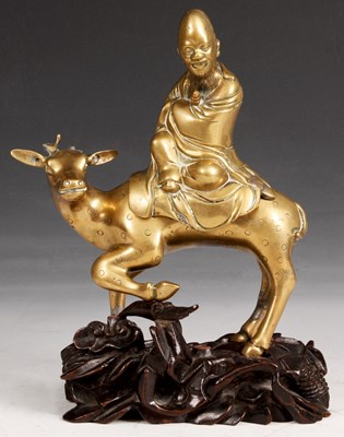 Lot 144 - An Oriental Cast Brass FIGURE of a Deer with a...